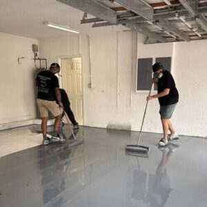 workers applying epoxy flooring